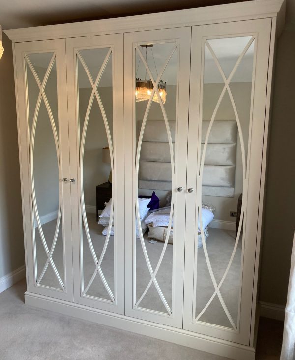 The Mayfair Mirror 4 Door Wardrobe Kit in Pure White. Cornice, skirting and end panels.