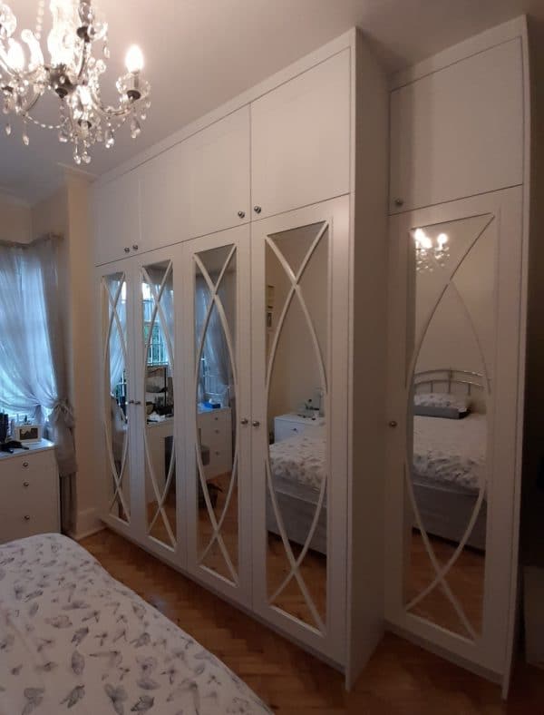 Mayfair wide angle bedroom wardrobe and top doors. Mirrored Fret Wardrobe Doors.